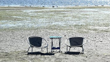 On the beach, sun-loungers, beach towels