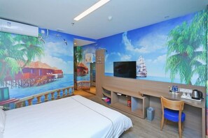 A hotel room with a bed, a desk with a chair, a television, and a mural of a tropical scene. - Mingyue Business Hotel (Shijiazhuang)