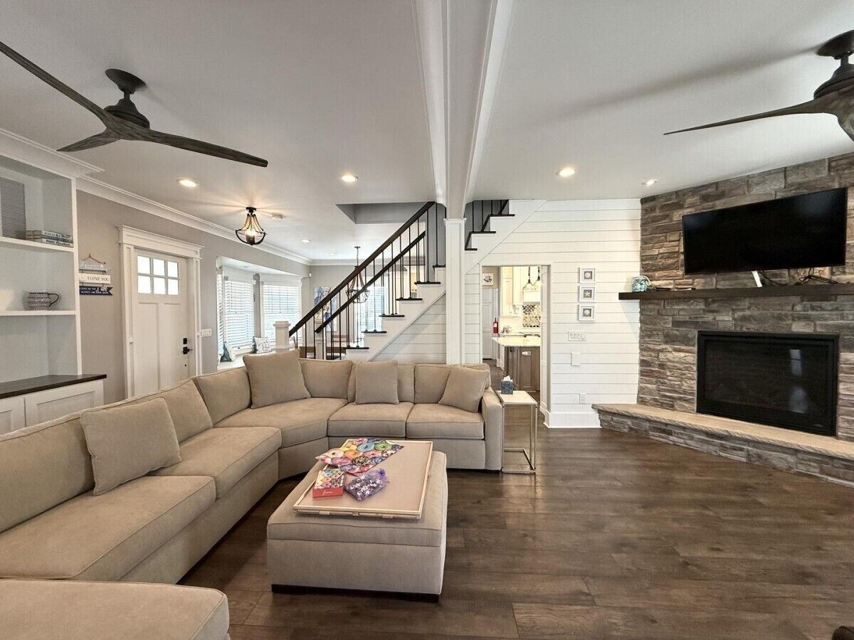 Smart TV, fireplace, books, computer monitors