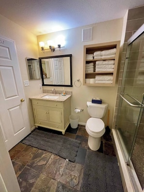 Shower, hair dryer, towels, soap