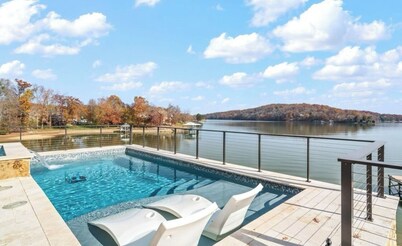Luxurious Lakefront Home with a Private Saltwater Pool, Spa, & Deep-Water Dock