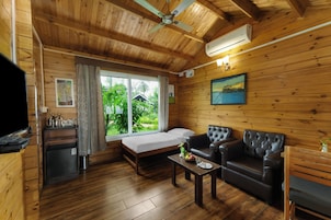 Deluxe Cottage, Balcony, Ocean View | In-room safe, desk, laptop workspace, iron/ironing board