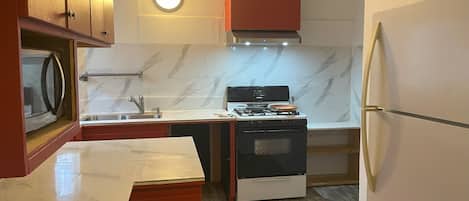 Microwave, stovetop, coffee/tea maker, electric kettle