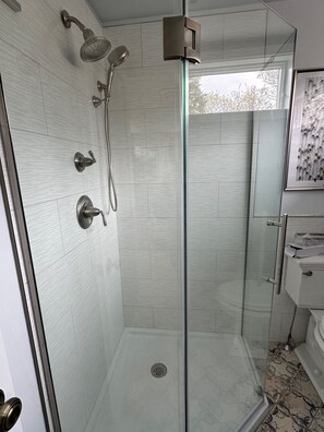 Shower, hair dryer, towels, toilet paper