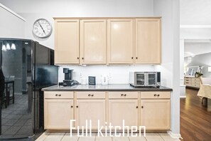 Enjoy cooking in this fully equipped kitchen with a microwave and coffee maker.