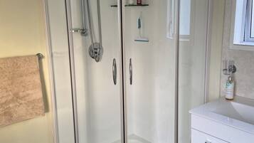 Shower, hair dryer, towels, soap
