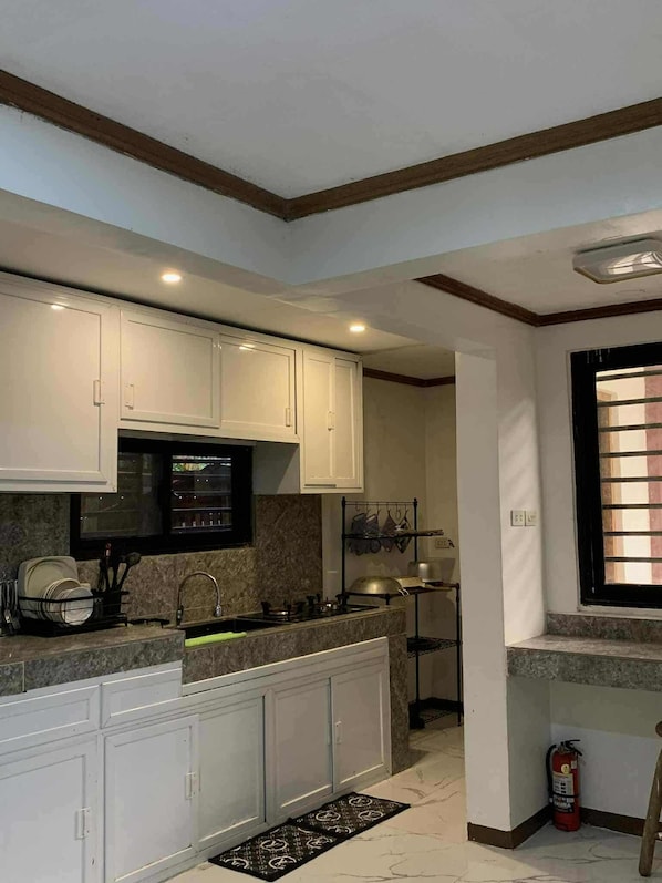 Fridge, microwave, stovetop, coffee/tea maker