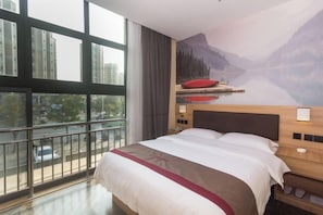 A hotel room with a large bed, a view of a cityscape through a window, and a mural of a mountain landscape on the wall. - Shankee Hotel (Shanghai Baoshan Yanghang Town) (Shanghai)