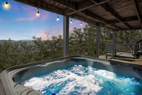 Outdoor spa tub. Mountain cabin w/ hot tub & game room