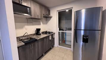 Microwave, coffee/tea maker, blender, cookware/dishes/utensils