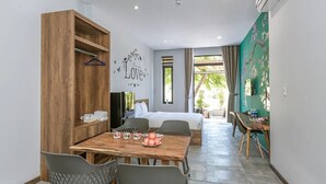 A modern bedroom with a wooden wardrobe, a bed, a bedside table, and a wall with a 'Love' decoration.
