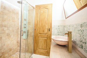 Apartment, 2 Bedrooms | Bathroom | Shower, hair dryer, slippers, towels