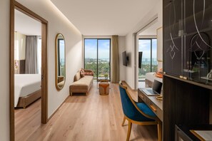 Two-Bedroom Family Ocean View | Living area | 45-inch Smart TV with satellite channels, ping pong - Royal Beachfront Resort Danang (Dien Ban)