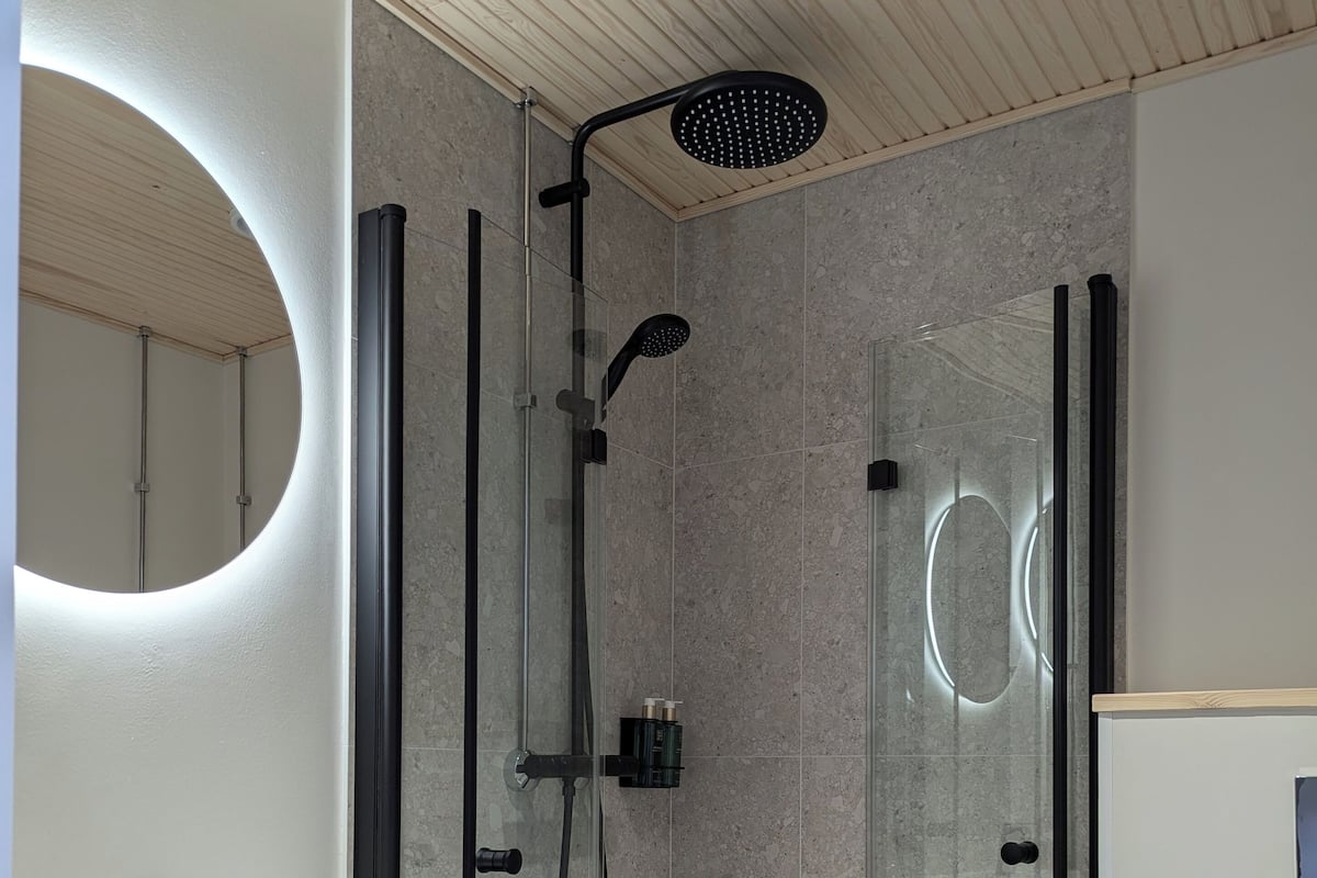 Shower, rainfall showerhead, hair dryer, towels