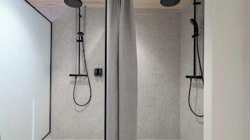 Shower, rainfall showerhead, hair dryer, towels