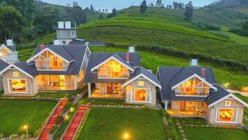 Stunning two-story houses blend into the lush hilly landscape.
