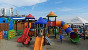 A playground with multiple slides and climbing structures. - Vibe Hotel (Cattolica)