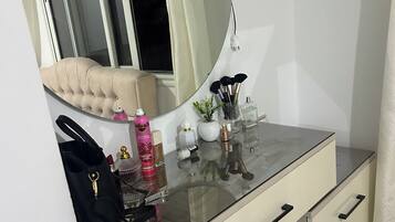 Shower, hair dryer, soap, toilet paper