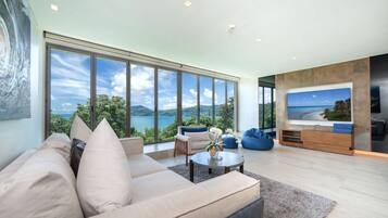 Design Condo, 3 Bedrooms, Sea View | Living area | Flat-screen TV