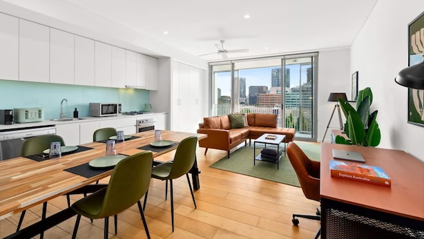 A modern apartment with a kitchen, dining area, and living space. - Central Charming 2 Bedrooms With Balcony Aircon (Sydney)