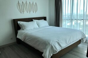 Premium Apartment, 2 Bedrooms, Balcony, City View | Minibar, desk, laptop workspace, blackout drapes - Springhill Royale Suites Sky Pool (Jakarta)