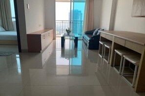 Deluxe Apartment, 2 Bedrooms, Balcony, City View | Living area | 42-inch flat-screen TV with cable channels - Springhill Royale Suites Sky Pool (Jakarta)