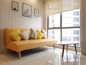 Deluxe Apartment, 2 Bedrooms, Balcony, City View | Living area | 42-inch flat-screen TV with cable channels