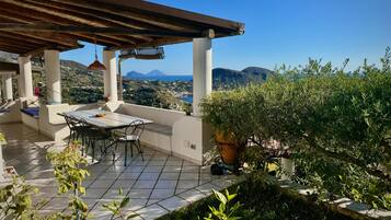 Enjoy al fresco dining with a view of the surrounding mountains and water.