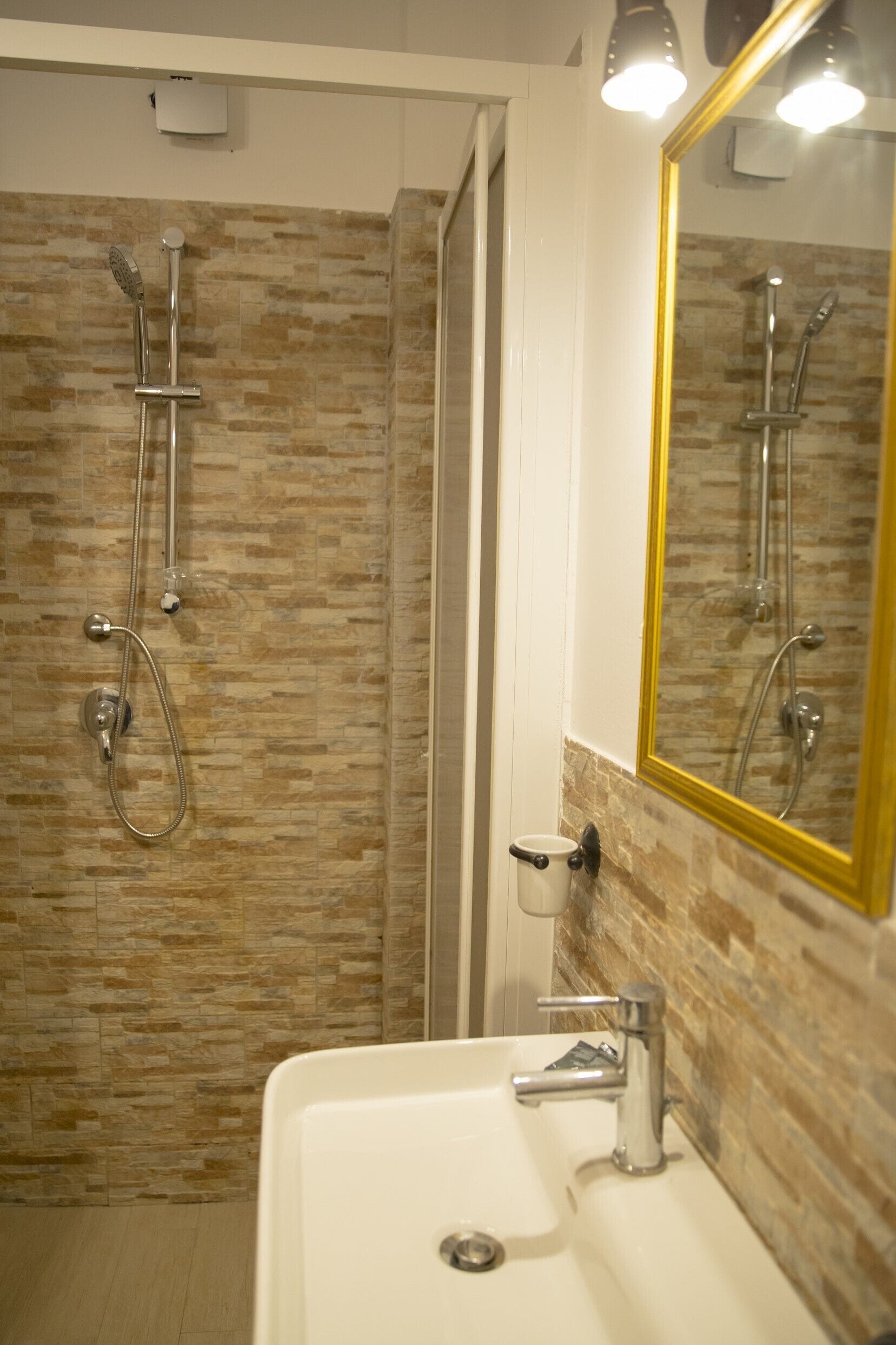 Classic Apartment | Bathroom | Shower, hair dryer, towels, soap