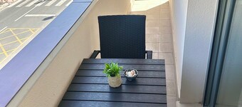 Bright Apartment with Wraparound L-Shaped Balcony