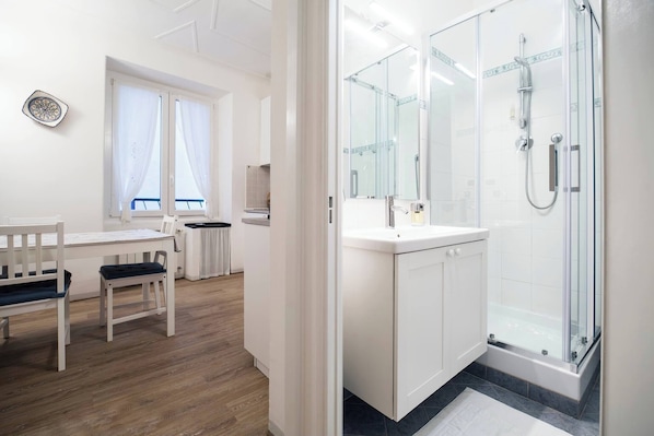 Shower, hair dryer, towels, soap
