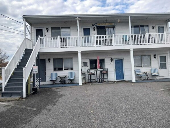 A two-story motel with a balcony, a staircase, and a sign reading 'Sunshine.' - 7 Mile beach is across the street.  Sleeps 3. Pets (Old Orchard Beach)