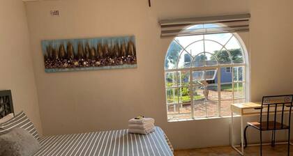 Cosy 2-Bedroom Retreat with Garden, Hot Water & Solar Backup