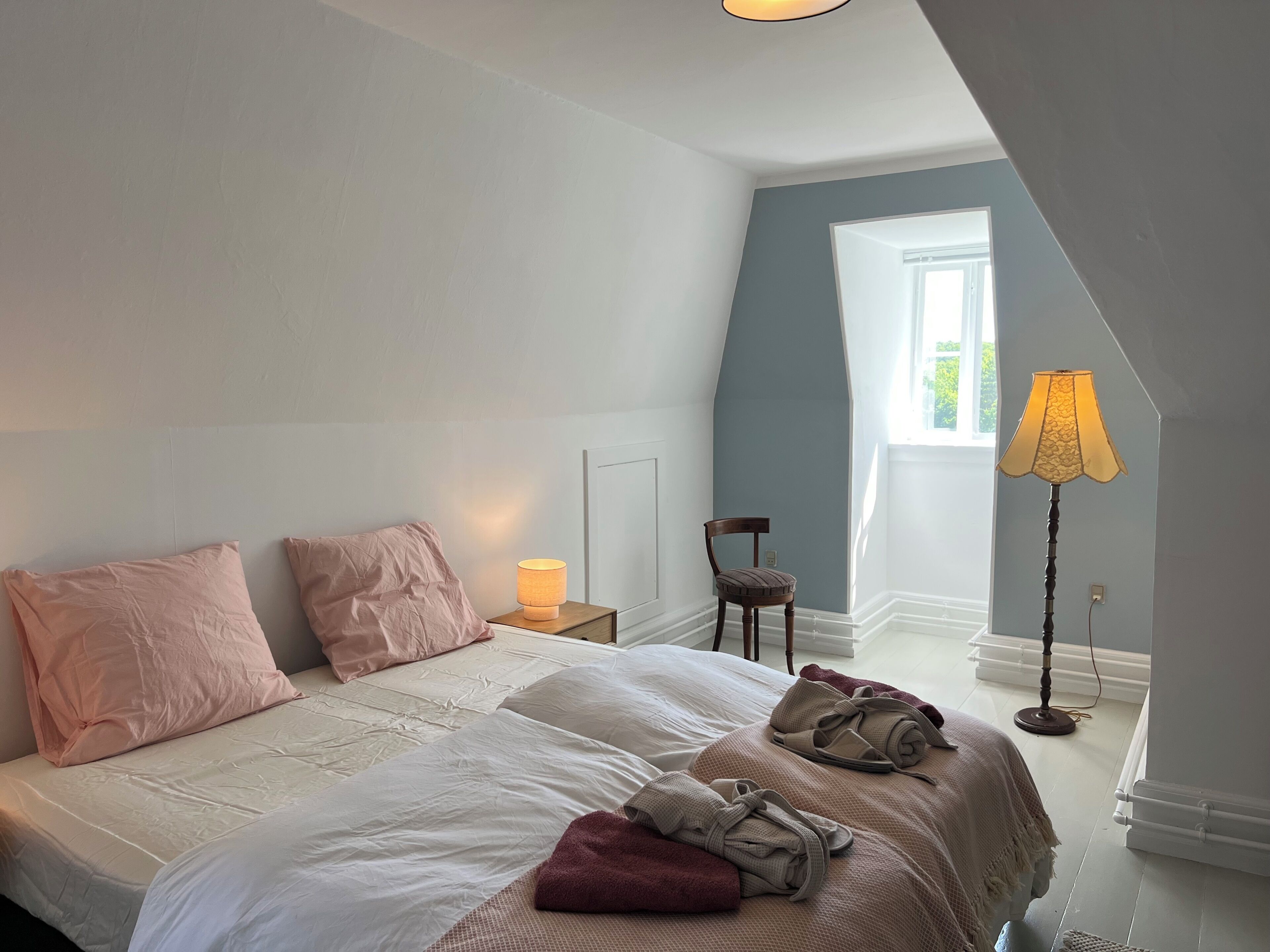 Premium bedding, down comforters, laptop workspace