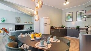 A modern kitchen with a dining area. - Bazzi 49 - Università Bocconi (Milan)
