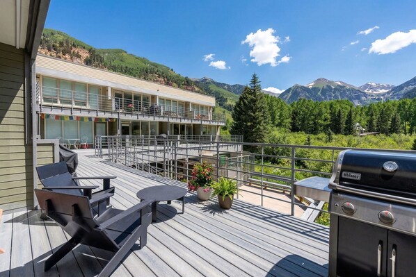 A deck with outdoor furniture, a grill, and a view of mountains. - Muscatel-Curate Telluride-Hot Tub, Views, Town Park, Near Gondola, Parking (Telluride)