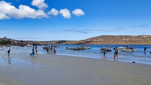 A beach with boats and people. - NIVICA Lifestyle Living 20, Langebaan 4-Sleeper (Langebaan)