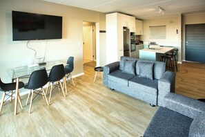 Family Apartment, Balcony, Bay View | Living area | 42-inch flat-screen TV with satellite channels, fireplace - NIVICA Lifestyle Living 20, Langebaan 4-Sleeper (Langebaan)