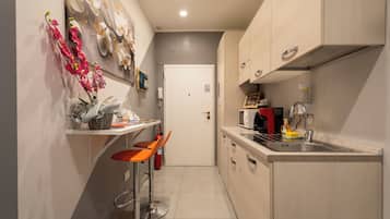 Mini-fridge, microwave, cookware/dishes/utensils