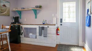 A kitchen with a coffee machine, a sink, and a fire extinguisher. - Twillingate Little Suite w/ Ocean & Garden View (Twillingate)