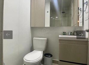 Shower, towels, soap, toilet paper