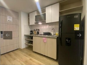 Fridge, microwave, stovetop, coffee/tea maker