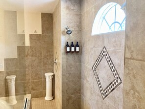 Shower, hair dryer, towels, soap