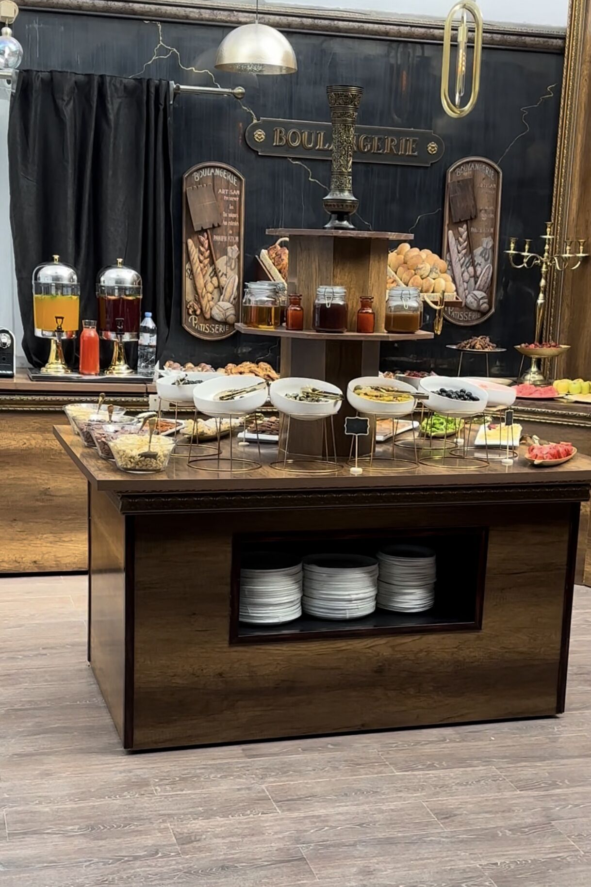 A buffet setup with various food items and beverages.