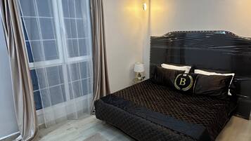 2 bedrooms, blackout drapes, soundproofing, iron/ironing board