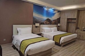 A hotel room with two beds, a nightstand, a wardrobe, and a large landscape mural on the wall. - Yuncheng Juhetai Hotel (Yanhu South Wind Square) (Yuncheng)