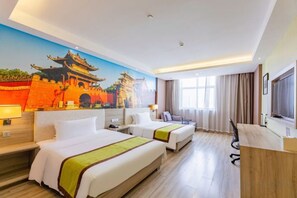 A hotel room with two beds, a desk, a chair, a TV, and a large window. - Yuncheng Juhetai Hotel (Yanhu South Wind Square) (Yuncheng)