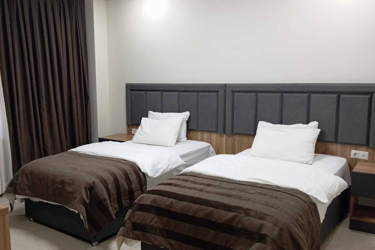 Desk, laptop workspace, blackout curtains, iron/ironing board