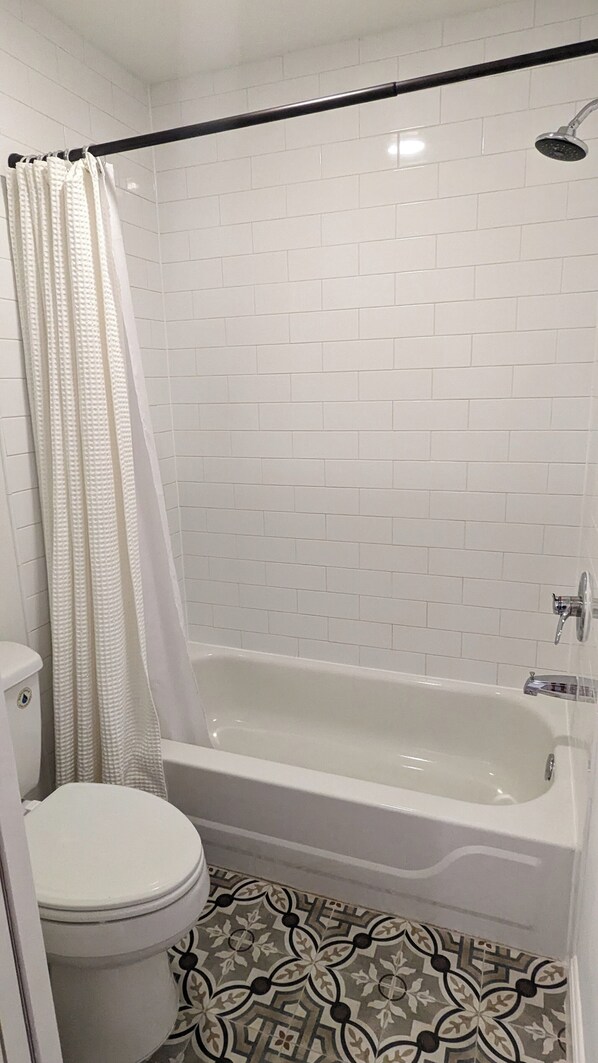 Jetted tub, hair dryer, towels, soap