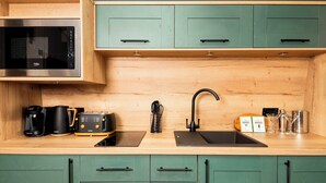 A kitchen with a microwave, toaster, coffee maker, and a sink. - Azure Horizons - Retreat Hot Tub Glamping Pod GV05 (Northampton)